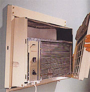 air conditioner with front panel removed to clean filter